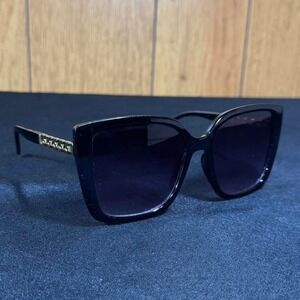 Black plastic sunglasses with gold chain detail
